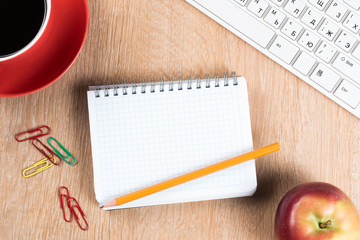 Stationery stuff on wooden table from top view
