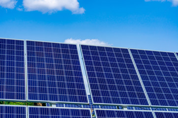 Solar panels on blue sky background