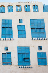 Obraz premium Exterior view of a recently renovated traditional residential town house in the historic district and old city Al Balad, Jeddah, Saudi Arabia