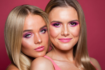Fototapeta premium Two happy beautiful women close up portrait