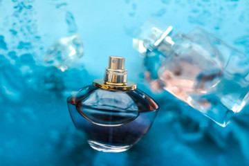 Perfume bottle under blue water, fresh sea coastal scent as glamour fragrance and eau de parfum...