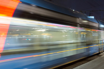 Blurred background of a tram on a hight street
