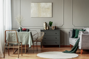 Elegant living and dining room interior with green and grey design