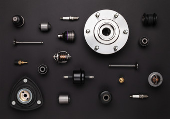 Studio photography - a lot of automotive parts: valves, spark plugs, silent blocks, thermostats, ...
