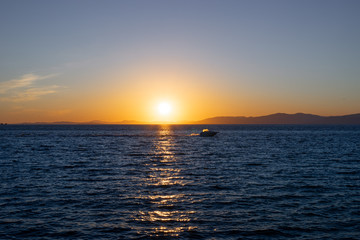 Seascape with sunset on the horizon. Vladivostok, Russia