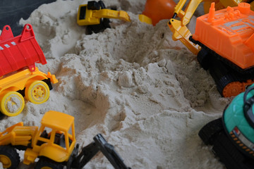 small kid toy vehicle construction in sand playground