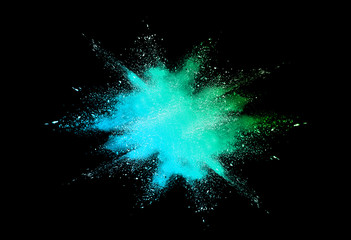 Multicolor powder explosion isolated on black background.