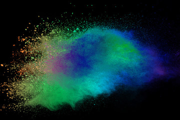 Multicolor powder explosion isolated on black background.
