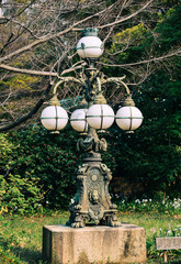 Retro vintage street lamp at the park in sunny day