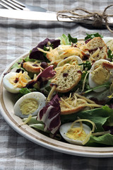 Keto diet. Healthy salad with quail eggs and cheese.