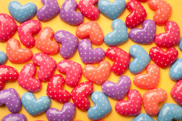 Fototapeta na wymiar jolly colorful hearts with polka dots creating joyful romantic love background 