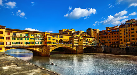 Fototapeta na wymiar Panorama view to ancient bridge Ponte Vecchio at river Arno in Florence old town, famous touristic place of Tuscany region, Italy.