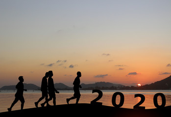 Silhouette running exercise.Concept new year's eve welcome new Year celebration 2020.