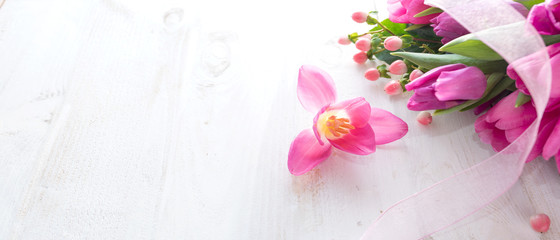 Pink tulips on white vintage background