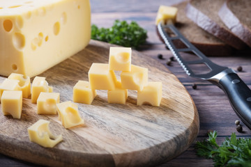 diced cheese on a wooden board