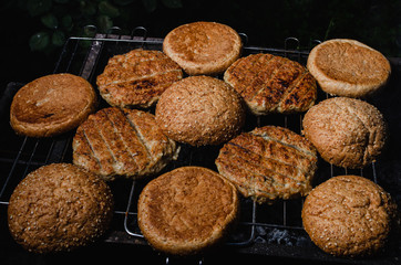 chicken burger composition on a bbq grill