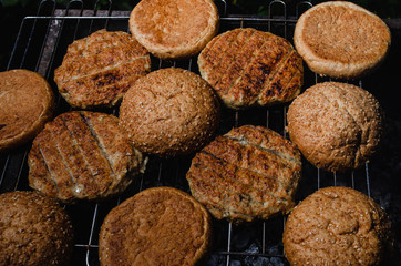 chicken burger composition on a bbq grill