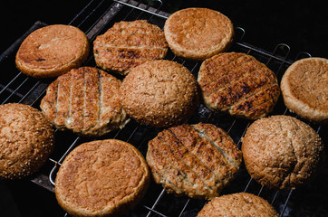chicken burger composition on a bbq grill