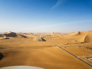 Fototapeta na wymiar Runway between sand dunes