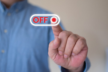 Businessman slides on off switch to off position, negative reaction