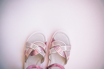 Baby girl pink sandals isolated on white background. Baby fashion pair pink sandals shoes for the toddlers feet.