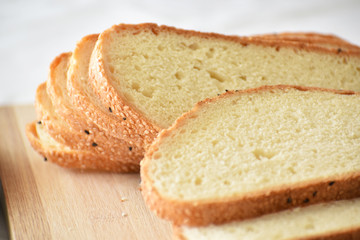 Multigrain bread on a chopping board. Selective focus. 