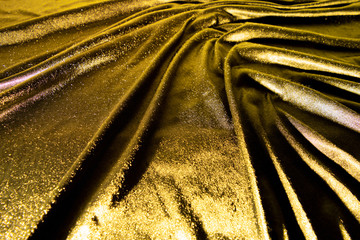 Gold luxury satin fabric texture and shadow for background
