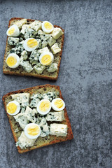 Keto diet. Toast with blue cheese and quail eggs. Keto toasts. Healthy snack.