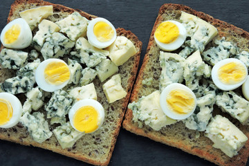 Keto diet. Toast with blue cheese and quail eggs. Keto toasts. Healthy snack.