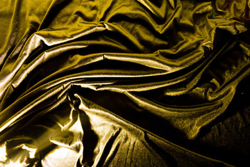 Gold luxury satin fabric texture and shadow for background
