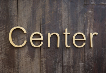Center sign on wooden background