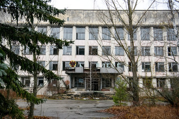 Abandoned ghost town Prypiat. Overgrown trees and collapsing buildings in Chornobyl exclusion zone....