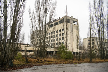 Abandoned ghost town Prypiat. Overgrown trees and collapsing buildings in Chornobyl exclusion zone....