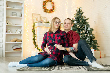 Married couple expecting baby at Christmas