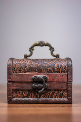  brown wooden box in vintage style on a gray background
