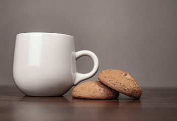cup of coffee and cookies on wooden table