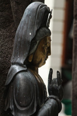 statue of soldier in front of castle