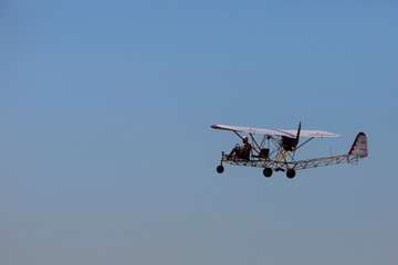 Ultralight airplane in the sky