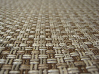 Fototapeta premium Background of brown textile texture. Macro photo