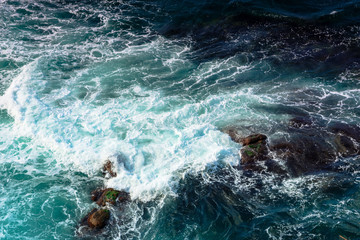 crushing sea waves texture. turquoise water background. dynamic water view from above 