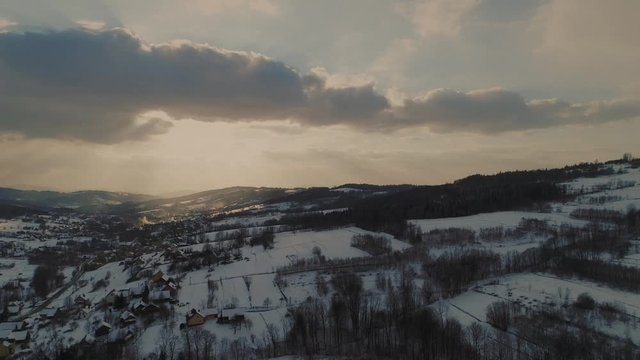 Typical Polish countryside in winter at sunset. Aerial, drone footage. 