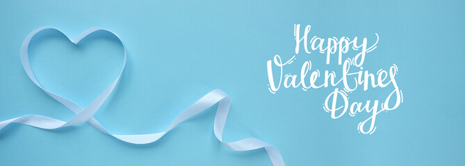 white ribbon in the shape of a heart