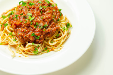 Minced beef bolognese with onions and carrots served with spaghetti