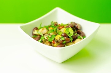 Kidney beans, butter beans and edamame beans with sweetcorn and grilled red peppers in a mint vinaigrette