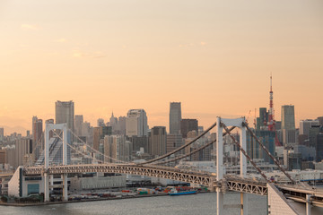 Fototapeta na wymiar Sunset view of Tokyo Bay , Rainbow bridge and Tokyo Tower landmark