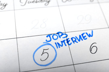Calendar with date reminder about job interview, closeup