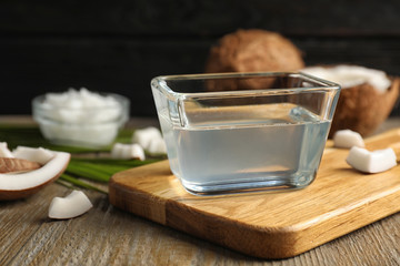 Coconut oil in bowl on wooden table