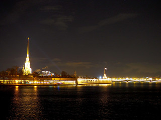 panoramic view of the Peter and Paul Fortress and the bridge across the Neva River at night