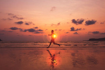 A man running at island and him running on the beach with sunset and beautiful sky with nice cloud.