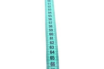 Closeup view of blue measuring tape isolated over white background